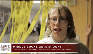 Student reporter with ID banner "Middle bucks Gets Spooky"